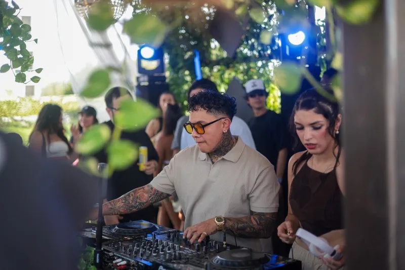 DJ on the decks at the Elsewhere Too day party photographed by BTA